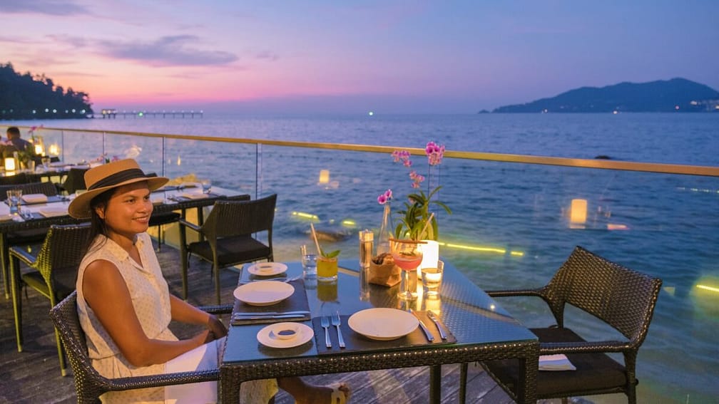 Romantic dinner on the beach with Thai food during sunset on the Island Phuket Thailand