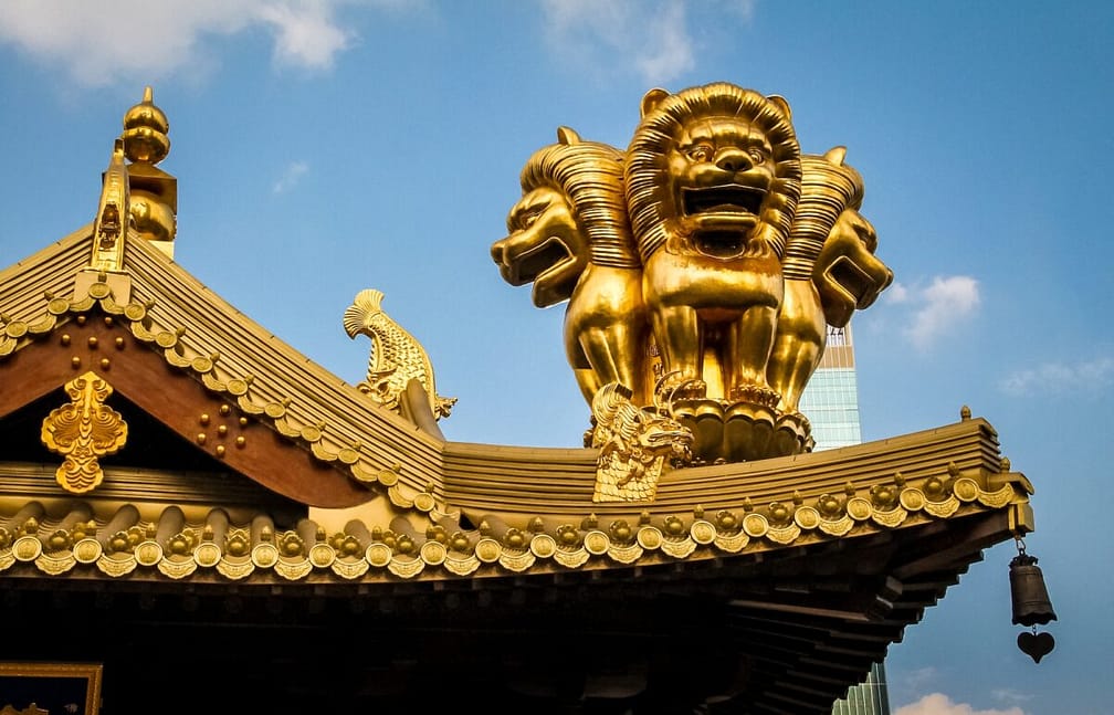 Details of roof golden Lions on Buddhist Jing An Tranquility Temple - Shanghai, China