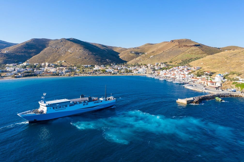 Ferry boat leaving Kea, Tzia island port, Greece. Aerial drone view.
