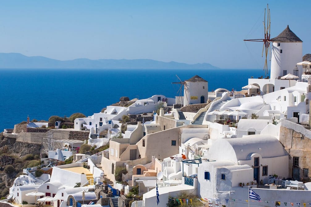 The Windmill in Oia and the Aegean Sea in Greece