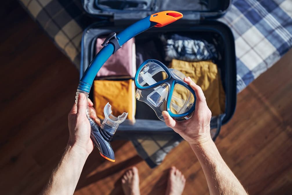 Packing suitcase and planning travel adventure