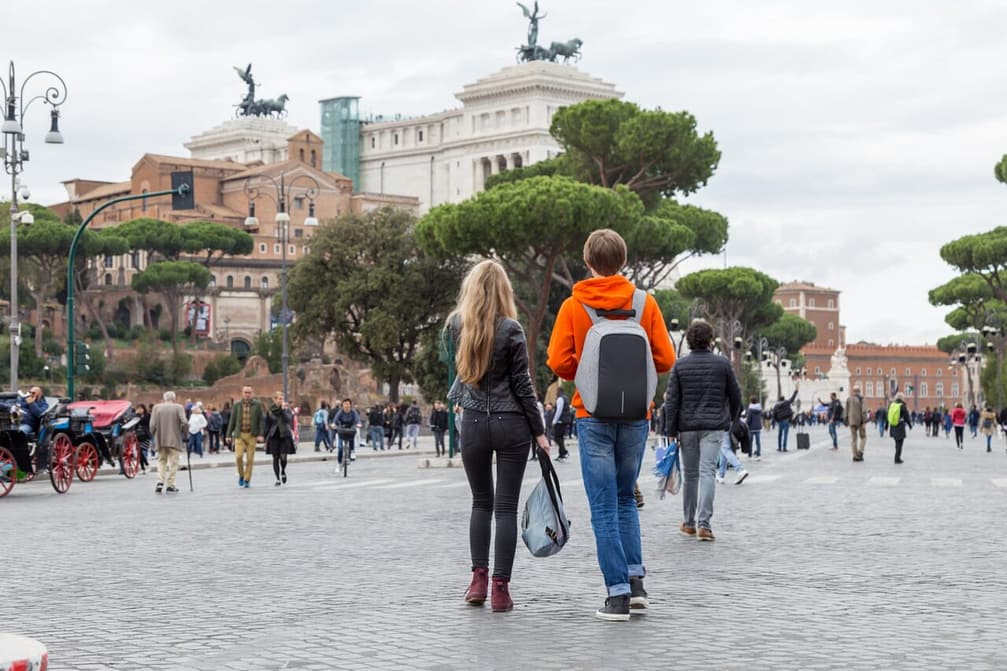 tourists walk in the center of Rome, Italy