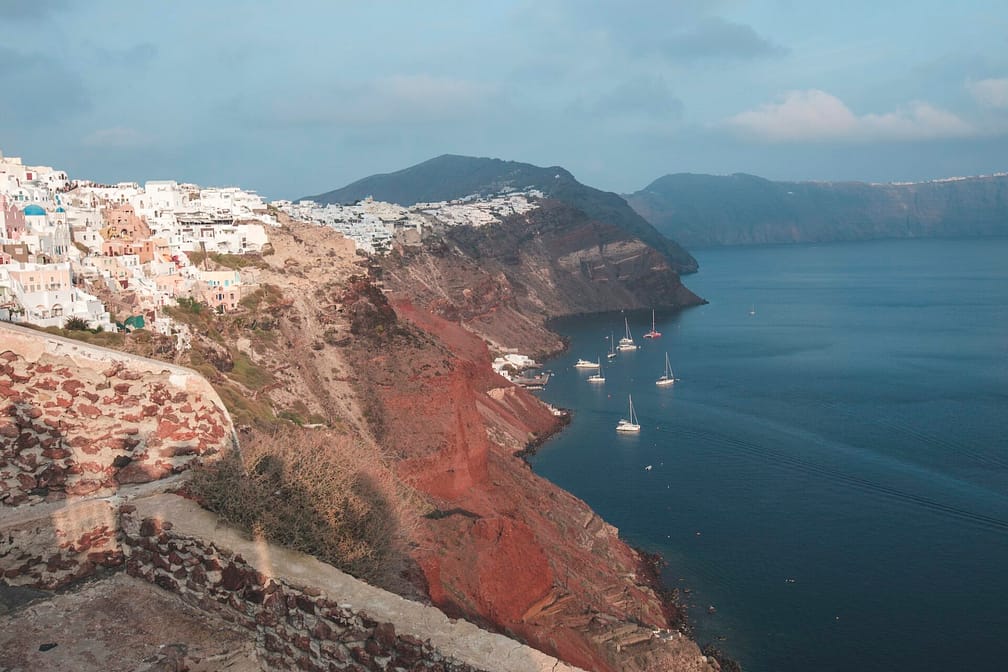 Cruise ships near the shore in the greek volcanic island of santorini