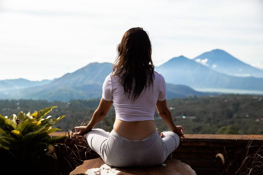 Yoga practice and meditation with amazing view on volcano in Bali