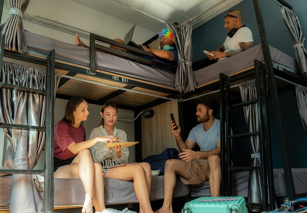 Groups of travelers in a hostel.