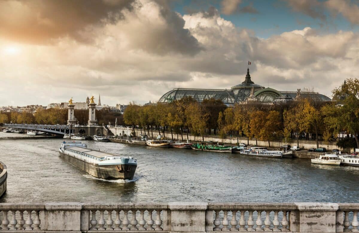 View of river Seine with the Grand Palace in distance, Paris, France