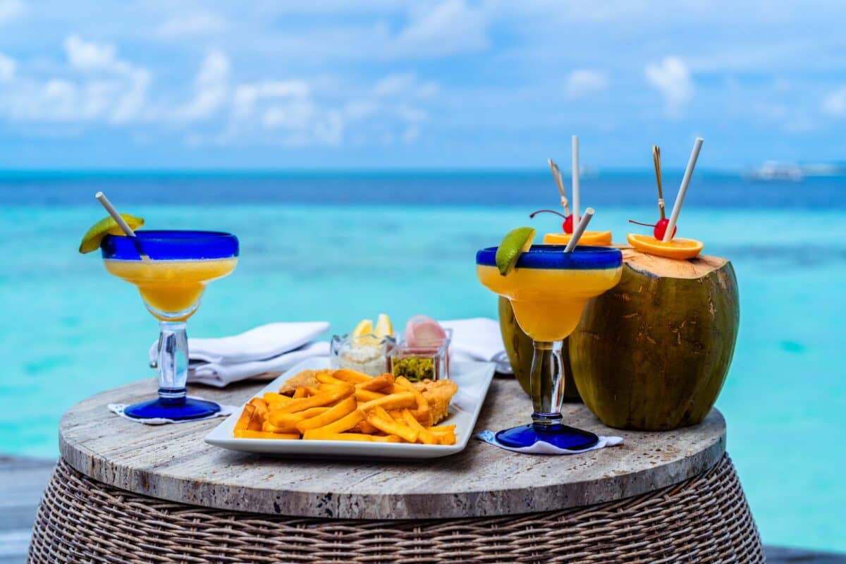 Enjoy delicious food and refreshing drinks with amazing view at turquoise sea on Maldives island