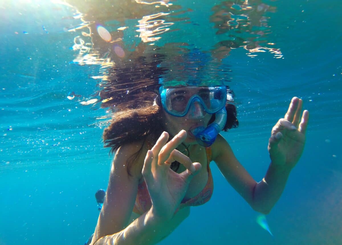 Girl snorkeling in Maldives, underwater view