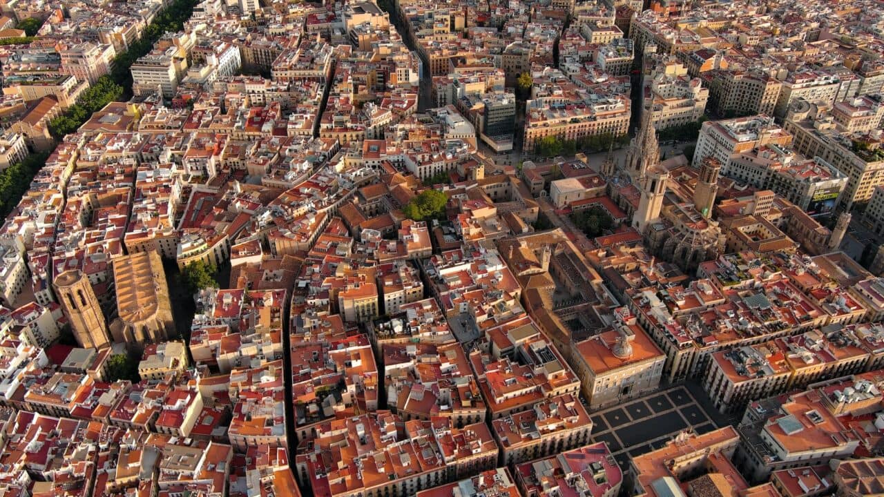 Aerial view of Barcelona skyline with Barcelona Cathedral and Gothic Quarter at sunrise