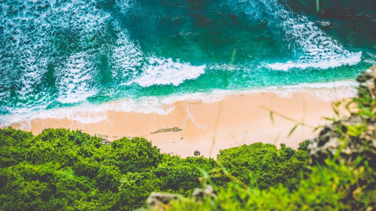 Top Aerial view of Nunggalan Beach near Uluwatu, Bali, Indonesia