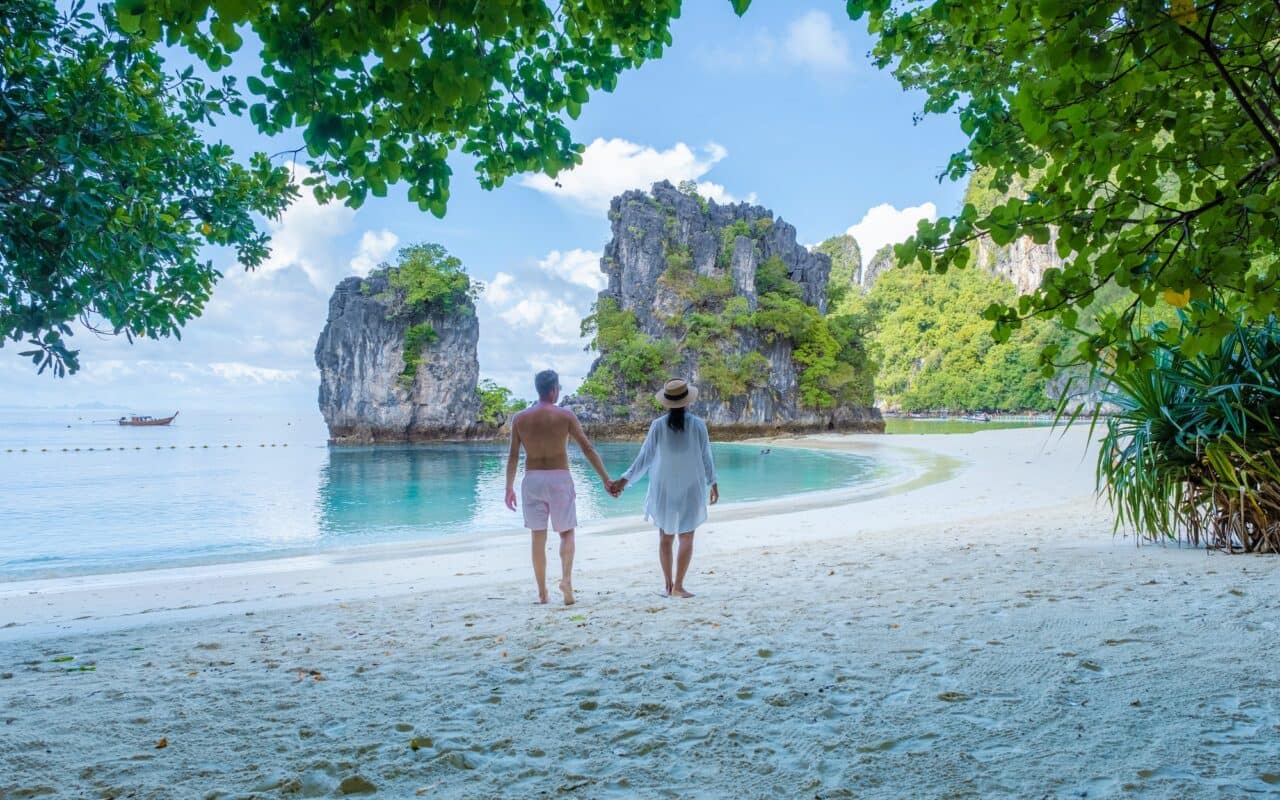 Koh Hong Island Krabi Thailand, a couple of men and woman on the beach of Koh Hong Island