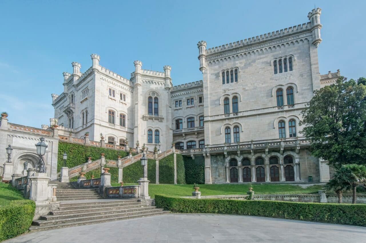 Exterior of Miramare Castle with lawns and steps, Trieste, Italy.