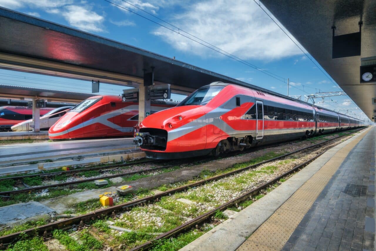 High speed trains on the train station at sunny day