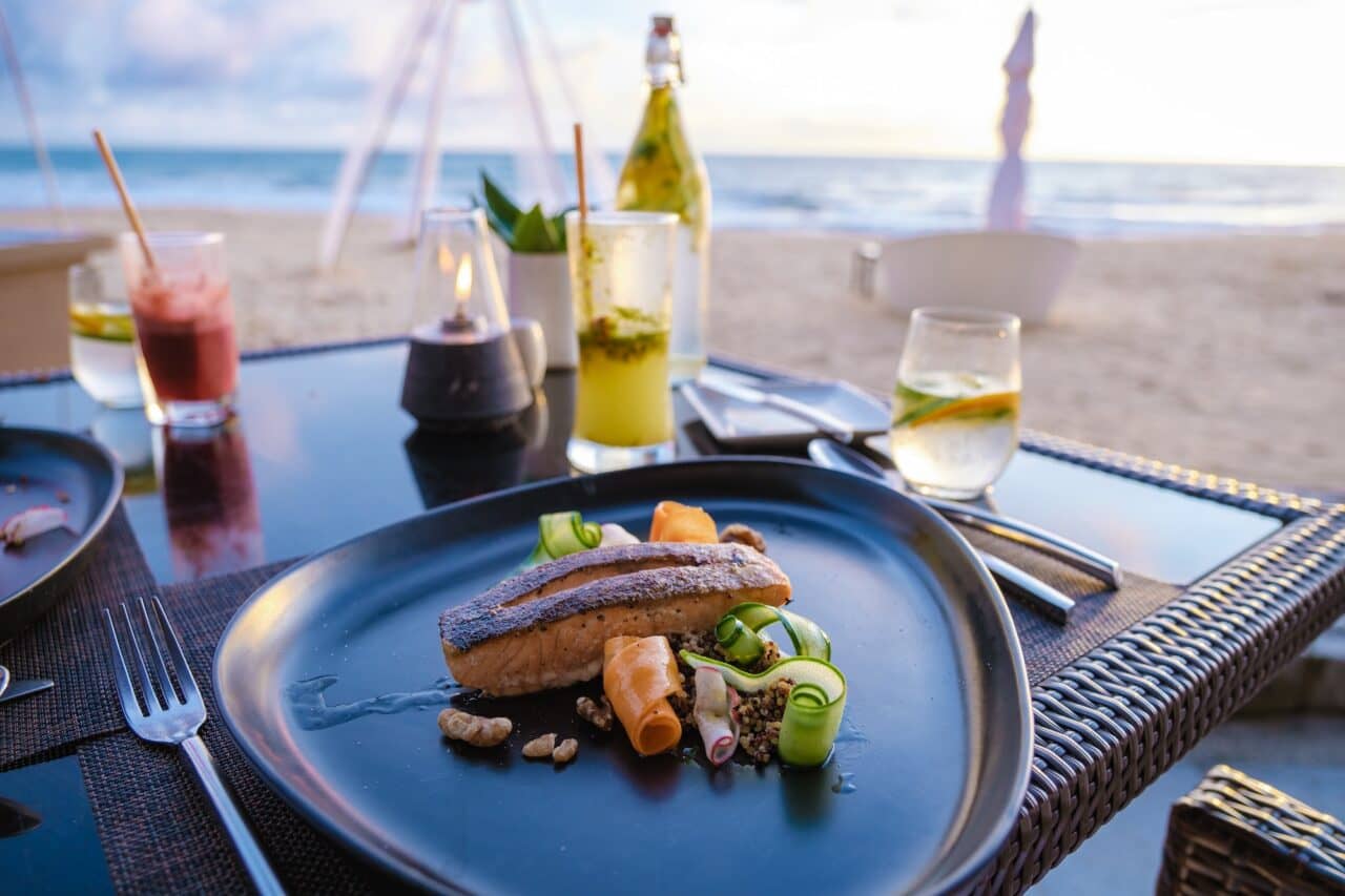 Grilled Salmon, Dinner during sunset on the beach in Phuket Thailand