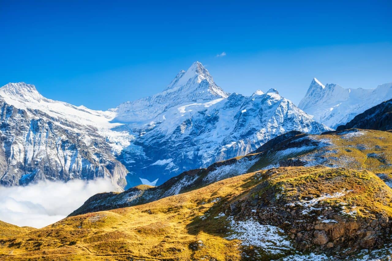 Mountain scenery in the Swiss Alps. Mountains peaks. Natural landscape. Mountain range and clear blu