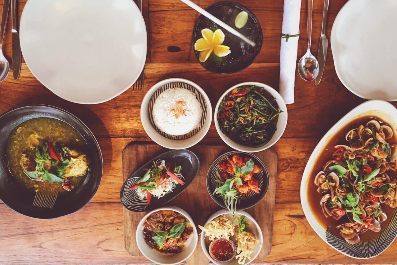 Top view of table with colourful Indonesian food