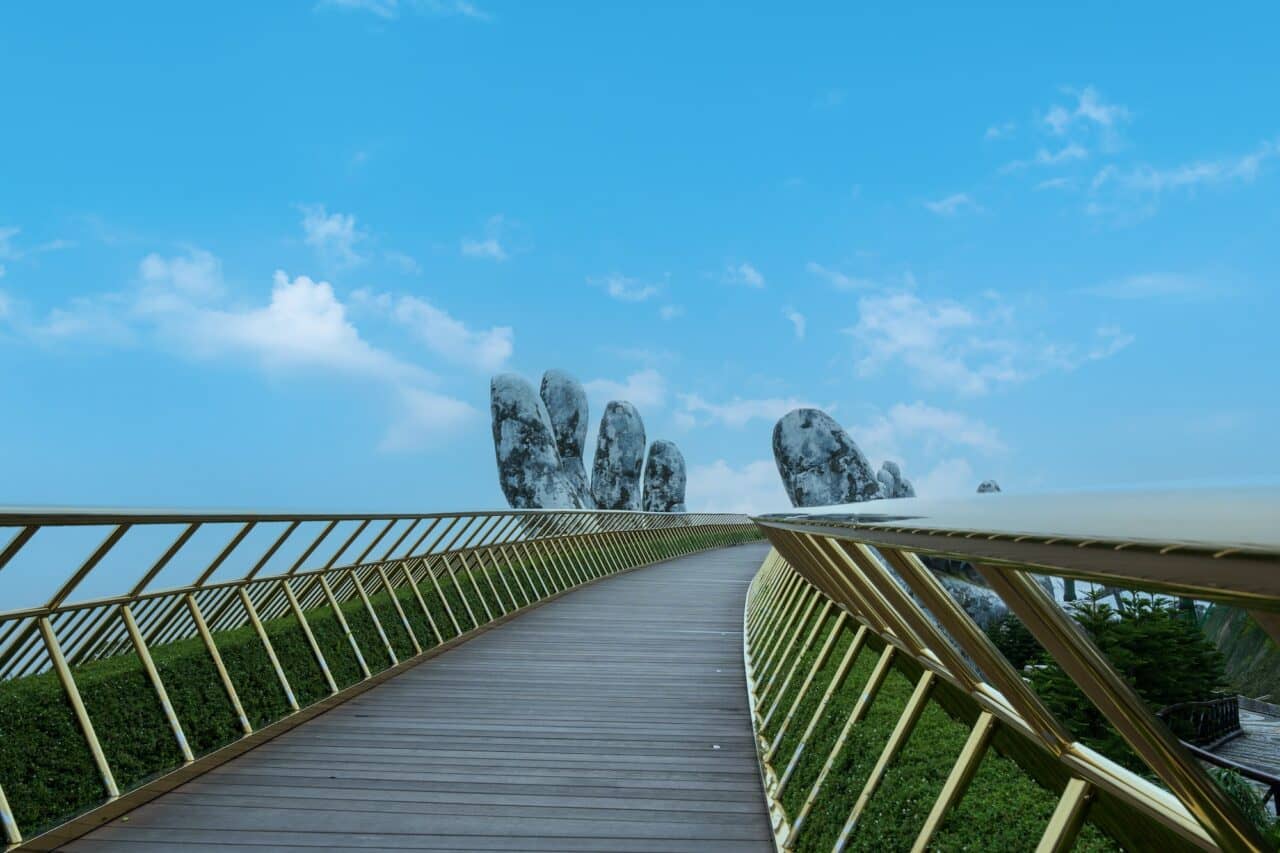 Landscape view of the Golden Bridge is lifted by two giant hands on Ba Na Hill, Da Nang, Vietnam.