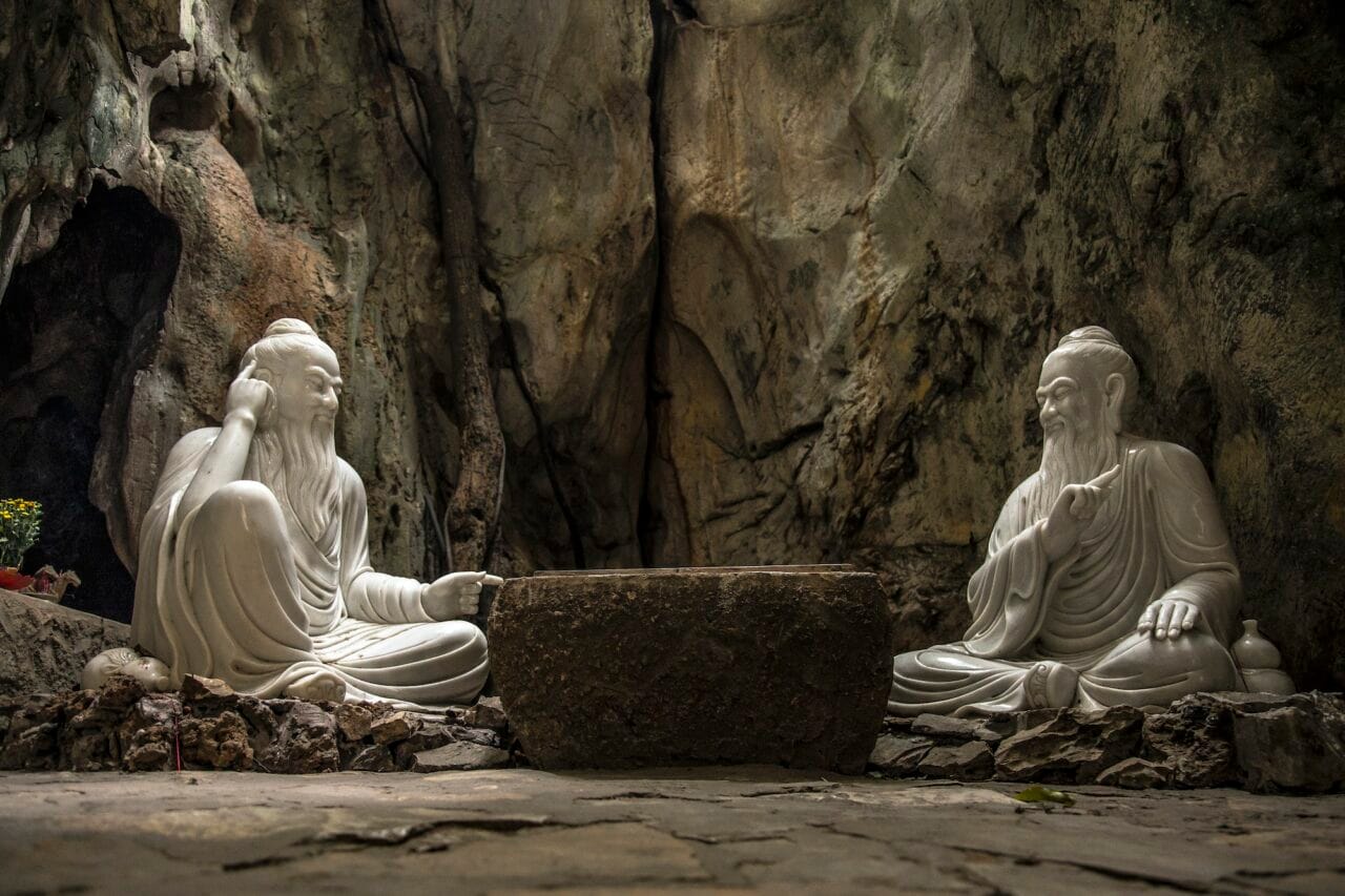 The white sculptures of the two wise men in the Marble Mountains of Da Nang