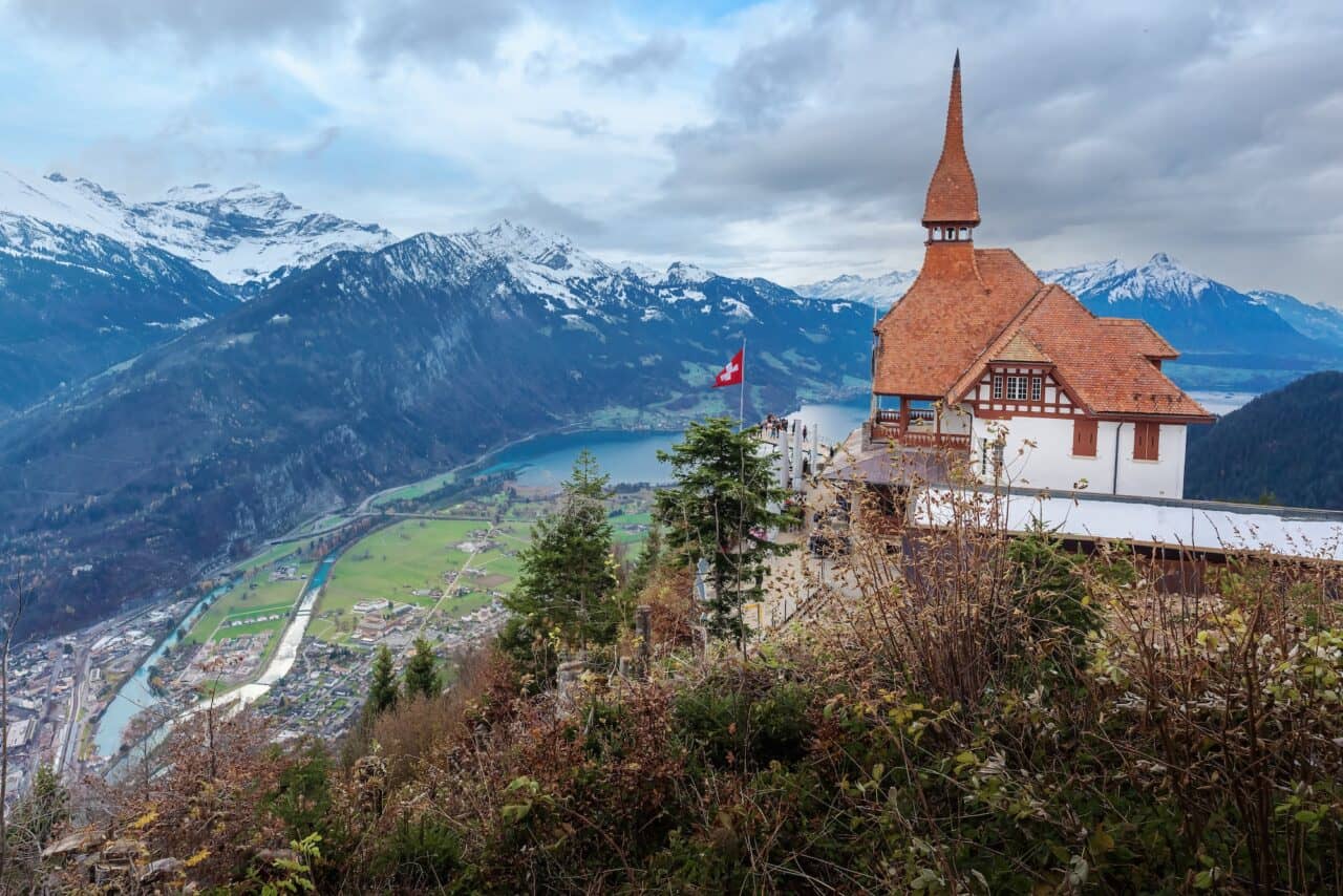 Aerial Harder Kulm Building with Swiss Flag - Interlaken, Switzerland