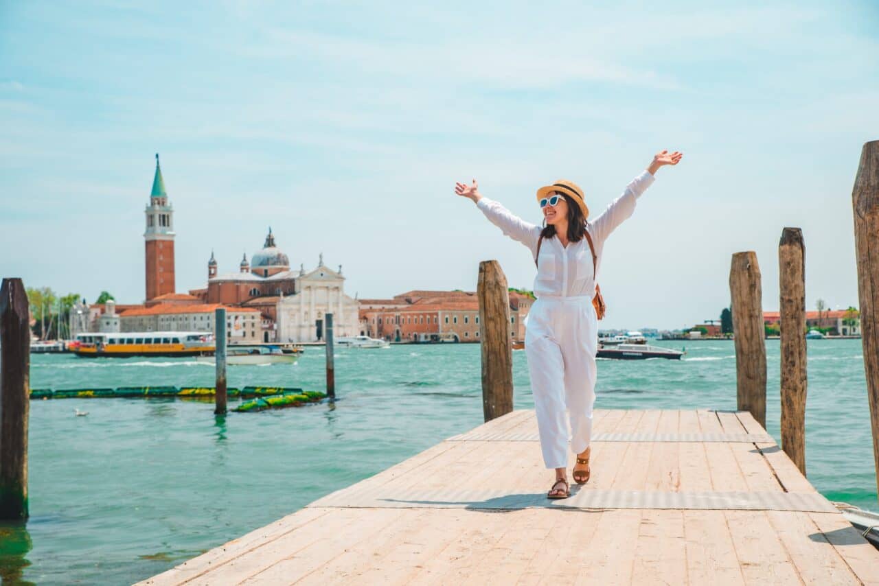 tourist woman looking at basilica san giorgio maggiore venice italy