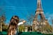 Children in Paris near the Eiffel Tower. Selective focus.